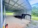 Spacious steel building with a trailer parked inside at 111 Ayers Driver Rd, Villa Rica, GA 30180