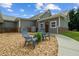 Charming home exterior with stone accents and inviting front porch seating at 111 Ayers Driver Rd, Villa Rica, GA 30180