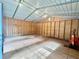 Unfinished garage interior featuring wood framing, concrete slab flooring, and ample space at 111 Ayers Driver Rd, Villa Rica, GA 30180