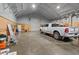 Spacious garage featuring a large roll-up door and ample room for vehicle storage at 111 Ayers Driver Rd, Villa Rica, GA 30180