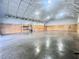 Spacious interior with concrete floors, insulated ceiling, wooden paneling, and an open layout at 111 Ayers Driver Rd, Villa Rica, GA 30180