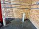 Close-up of the interior showing concrete flooring, wooden paneling, and plumbing fixtures at 111 Ayers Driver Rd, Villa Rica, GA 30180