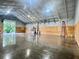 Spacious interior view with concrete floors, wooden paneling, and high, insulated ceilings, perfect for commercial use at 111 Ayers Driver Rd, Villa Rica, GA 30180