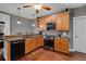 Functional kitchen with modern appliances, granite counters, and warm wood cabinets at 111 Ayers Driver Rd, Villa Rica, GA 30180