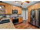 Well-equipped kitchen with stainless steel appliances, wood cabinets and granite countertops at 111 Ayers Driver Rd, Villa Rica, GA 30180