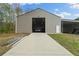 Spacious outbuilding with a wide door and ample space for vehicle storage at 111 Ayers Driver Rd, Villa Rica, GA 30180