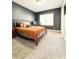 Bedroom with neutral carpet, queen size bed and nice natural lighting at 1166 Farmstead Rd, Suwanee, GA 30024