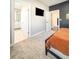 Bedroom featuring neutral carpet with view into the ensuite bathroom at 1166 Farmstead Rd, Suwanee, GA 30024