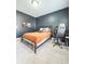 Bedroom with neutral carpet, queen size bed, desk and computer for work or study at 1166 Farmstead Rd, Suwanee, GA 30024