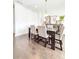 Formal dining area featuring a dining table, hardwood floors, and modern decor at 1166 Farmstead Rd, Suwanee, GA 30024