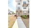 Attractive three-story townhouse with brick accents and a manicured front lawn at 1166 Farmstead Rd, Suwanee, GA 30024