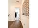 Upstairs hallway with wood floors, white walls, and decorative mirror at 1166 Farmstead Rd, Suwanee, GA 30024