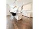 Spacious kitchen with modern stainless steel appliances, white cabinets, and a kitchen island at 1166 Farmstead Rd, Suwanee, GA 30024