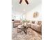Living room showcases an open floor plan with sleek hardwood floors and contemporary decor at 1166 Farmstead Rd, Suwanee, GA 30024