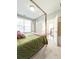 Bright main bedroom with neutral tones, a plush bed, and plenty of sunlight at 1166 Farmstead Rd, Suwanee, GA 30024