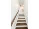 Staircase features dark wood treads with white risers and white stringers at 1166 Farmstead Rd, Suwanee, GA 30024