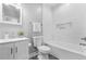 Well-lit bathroom features a tub-shower combo, vanity, and modern fixtures at 1716 Browning Sw St, Atlanta, GA 30314