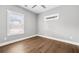 Bedroom features hardwood floors, neutral paint, and double-paned windows for ample natural light at 1716 Browning Sw St, Atlanta, GA 30314