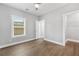 Spacious bedroom with hard wood floors and open door to walk-in closet at 1716 Browning Sw St, Atlanta, GA 30314