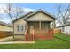 Inviting single-story home with a covered front porch, complemented by fresh landscaping and an exterior with neutral tones at 1716 Browning Sw St, Atlanta, GA 30314