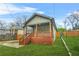 Charming home with a covered porch, wooden railings, and a well-maintained front yard at 1716 Browning Sw St, Atlanta, GA 30314