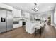 Modern kitchen featuring stainless steel appliances, white cabinetry, and an island with seating at 1716 Browning Sw St, Atlanta, GA 30314