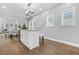 Bright kitchen featuring a central island with counter seating and modern stainless steel appliances at 1716 Browning Sw St, Atlanta, GA 30314