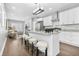Bright kitchen boasts stainless appliances, granite counters, island with seating, and open floorplan at 1716 Browning Sw St, Atlanta, GA 30314