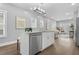 Bright kitchen with a central island, stainless steel appliances, and open access to the living space at 1716 Browning Sw St, Atlanta, GA 30314