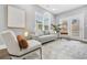 Bright living room with stylish decor, neutral colors, lots of light, and access to outside area at 1716 Browning Sw St, Atlanta, GA 30314