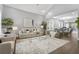 Open-concept living room with vaulted ceilings, modern decor, hardwood floors, and an abundance of natural light at 1716 Browning Sw St, Atlanta, GA 30314