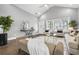 Bright and airy living room featuring a vaulted ceiling, modern furnishings, and large windows for ample natural light at 1716 Browning Sw St, Atlanta, GA 30314