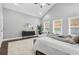 Spacious main bedroom with cathedral ceiling, ceiling fan, windows and modern décor at 1716 Browning Sw St, Atlanta, GA 30314
