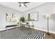 Office space featuring ceiling fan, black and white rug and lots of natural light at 1716 Browning Sw St, Atlanta, GA 30314