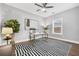 Office space featuring ceiling fan, black and white rug and lots of natural light at 1716 Browning Sw St, Atlanta, GA 30314