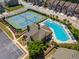 Aerial view of the community pool, tennis courts, clubhouse, and manicured landscaping at 2436 Sardis Chase Ct, Buford, GA 30519