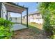Charming backyard featuring a small grass area, trees and a pergola at 2436 Sardis Chase Ct, Buford, GA 30519