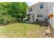 Charming backyard featuring a small grass area, trees and a pergola at 2436 Sardis Chase Ct, Buford, GA 30519