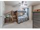 Comfortable bedroom with carpet, ceiling fan, bunk beds and large dresser at 2436 Sardis Chase Ct, Buford, GA 30519