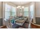 Bright dining area with natural light, stylish furniture, and a welcoming atmosphere at 2436 Sardis Chase Ct, Buford, GA 30519