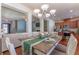 Open-concept dining area seamlessly connecting the kitchen and living spaces, great for entertaining at 2436 Sardis Chase Ct, Buford, GA 30519