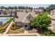 Charming home featuring brick and stone accents, a manicured lawn, and access to community tennis courts at 2436 Sardis Chase Ct, Buford, GA 30519