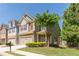 Beautifully landscaped front yard with a two-story home and inviting curb appeal on a sunny day at 2436 Sardis Chase Ct, Buford, GA 30519