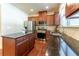 Gourmet kitchen with stainless steel appliances and center island featuring granite countertops at 2436 Sardis Chase Ct, Buford, GA 30519