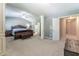 Bright main bedroom with a tray ceiling, and ensuite bath entrance at 2436 Sardis Chase Ct, Buford, GA 30519