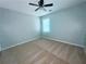 Bedroom with a ceiling fan, window, and neutral carpet at 440 Sheppard Xing Ct, Stone Mountain, GA 30083