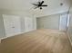 Spacious bedroom with neutral carpet, ceiling fan, and ample closet space at 440 Sheppard Xing Ct, Stone Mountain, GA 30083