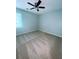 Cozy bedroom featuring a ceiling fan and neutral carpeting at 440 Sheppard Xing Ct, Stone Mountain, GA 30083