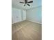 Carpeted bedroom with ceiling fan and closet at 440 Sheppard Xing Ct, Stone Mountain, GA 30083