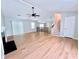 Spacious living room with hardwood floors, vaulted ceiling, ceiling fan, stairs, and entry door at 440 Sheppard Xing Ct, Stone Mountain, GA 30083